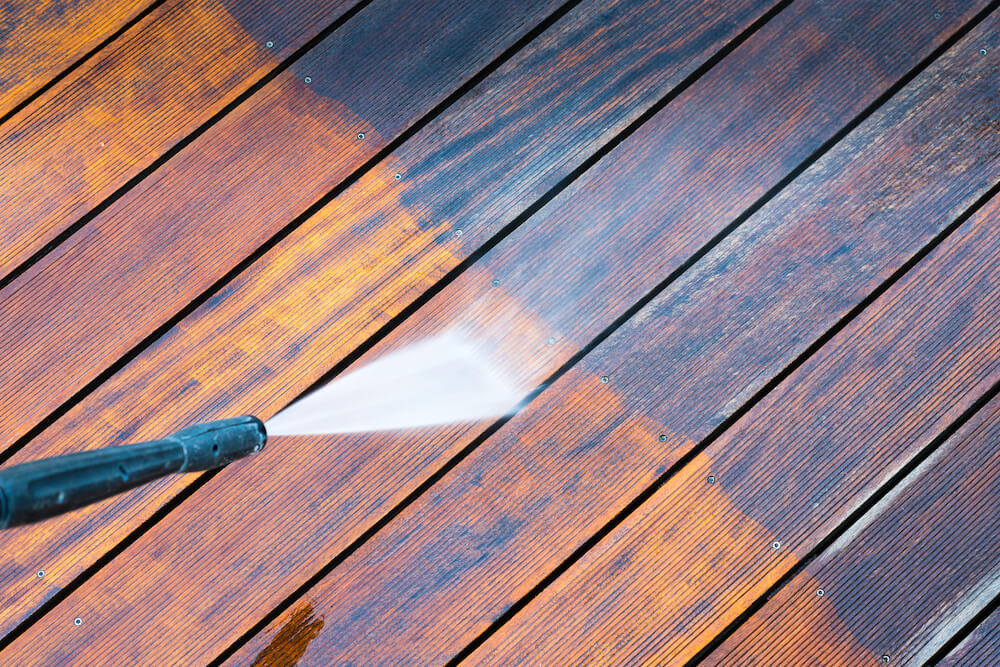 cleaning a deck using power hose